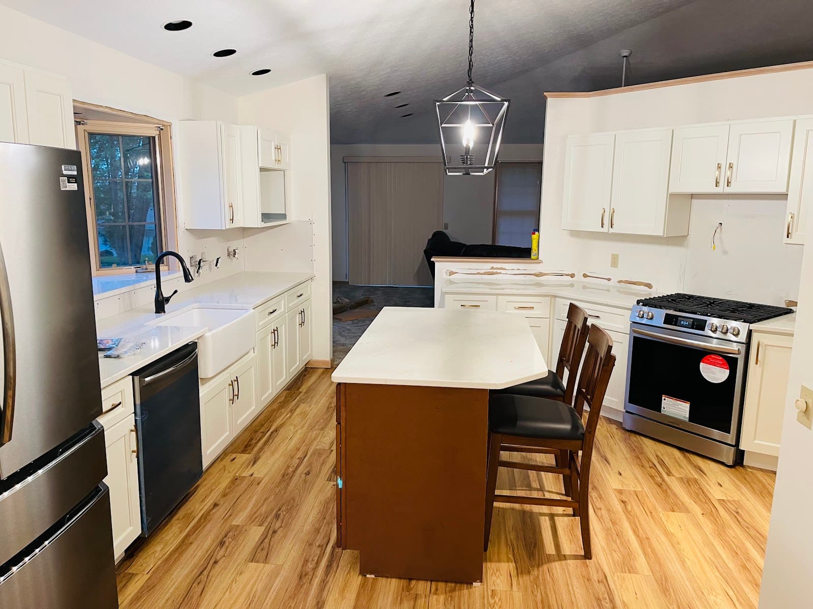 Kitchen renovation with custom cabinets, stone countertops, and tile backsplash in Northeast Ohio