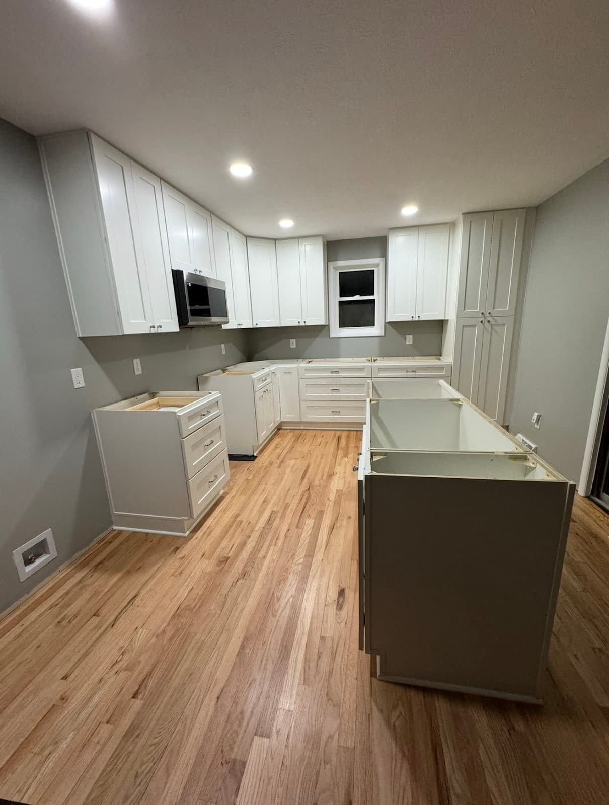 Kitchen remodel with two-tone cabinetry and Calacatta quartz countertops in Lake County Ohio
