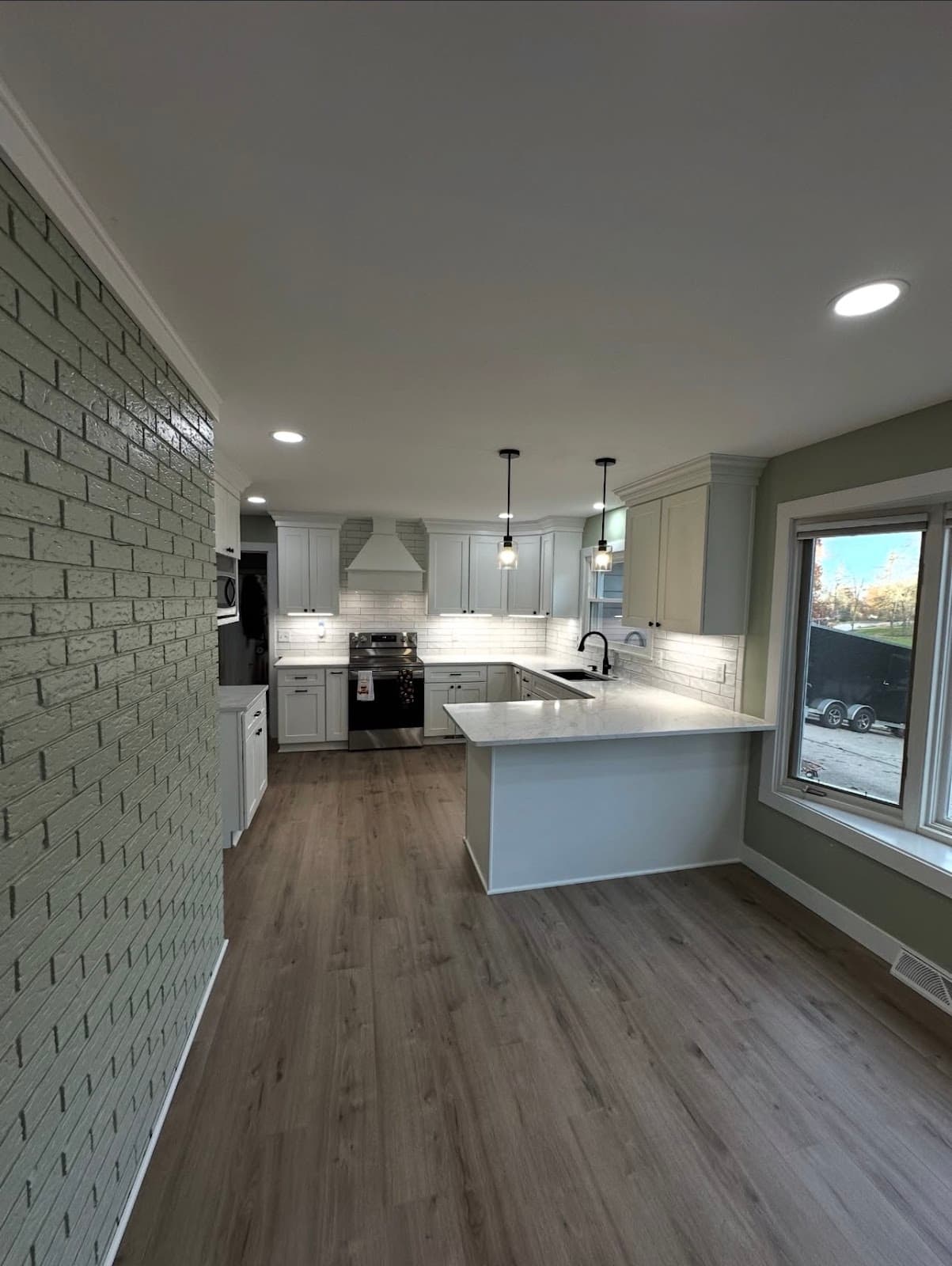 Full kitchen renovation with updated cabinetry, countertops, and backsplash in Lake County Ohio