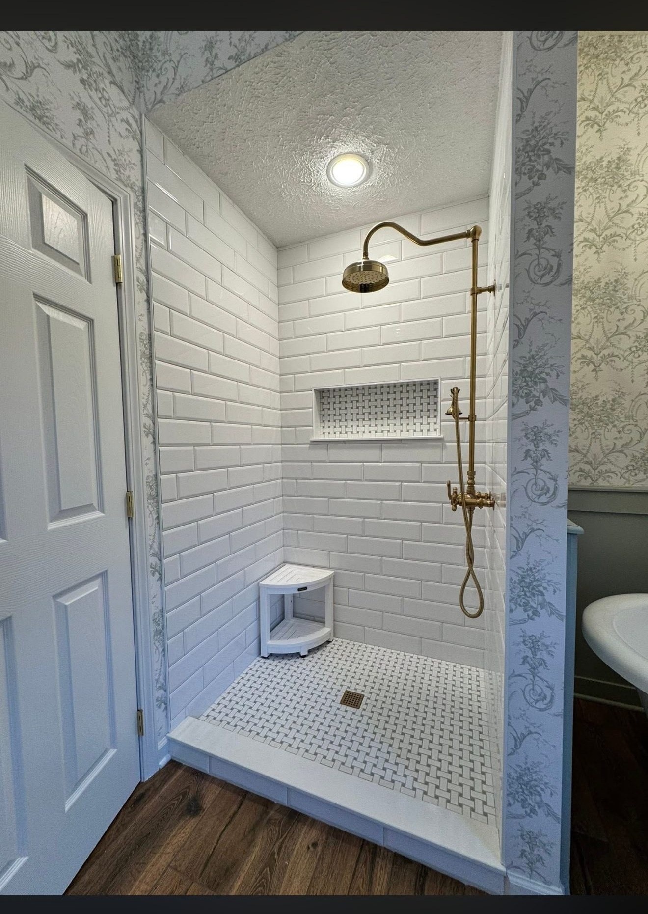 Hall bathroom renovation with subway tile and new fixtures