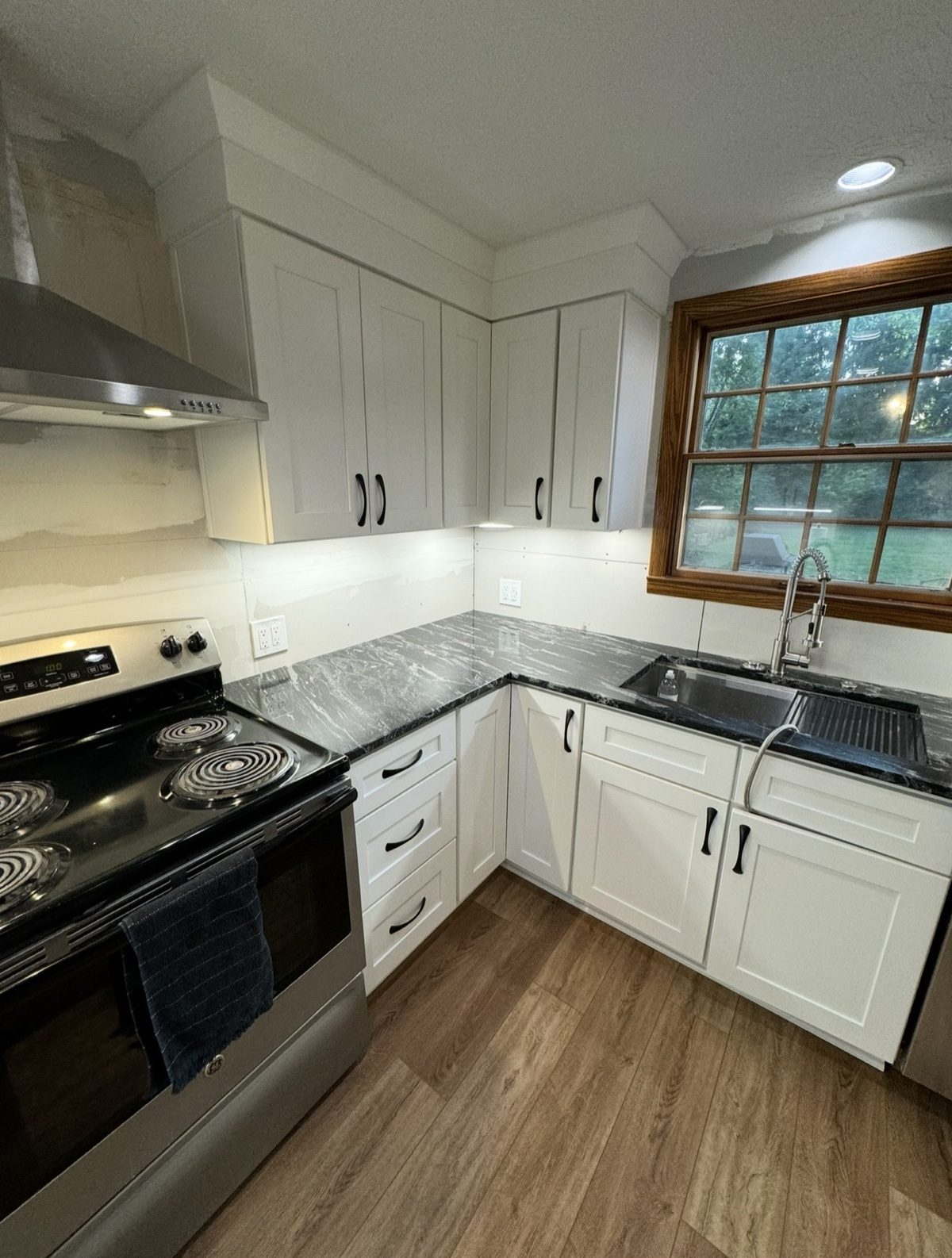 Complete kitchen gut renovation with hardwood floors